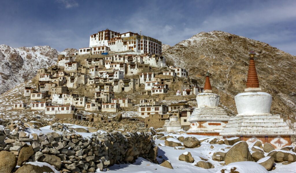 Exterior of abandoned residential district with shabby worn out buildings located in mountainous valley